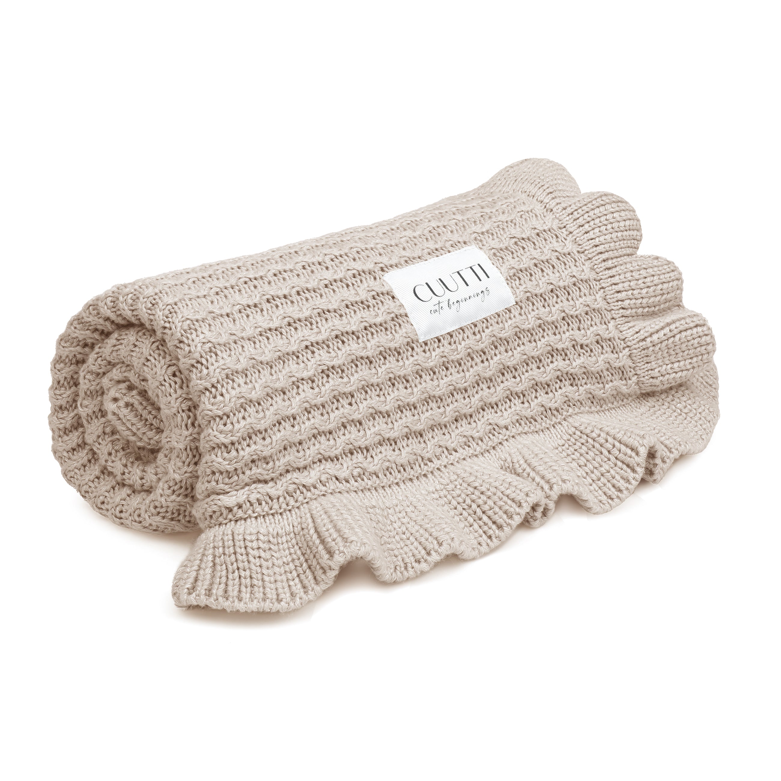 #color_beige CUUTTI bamboo blanket Ballerina in beige color, neatly rolled against a white background.