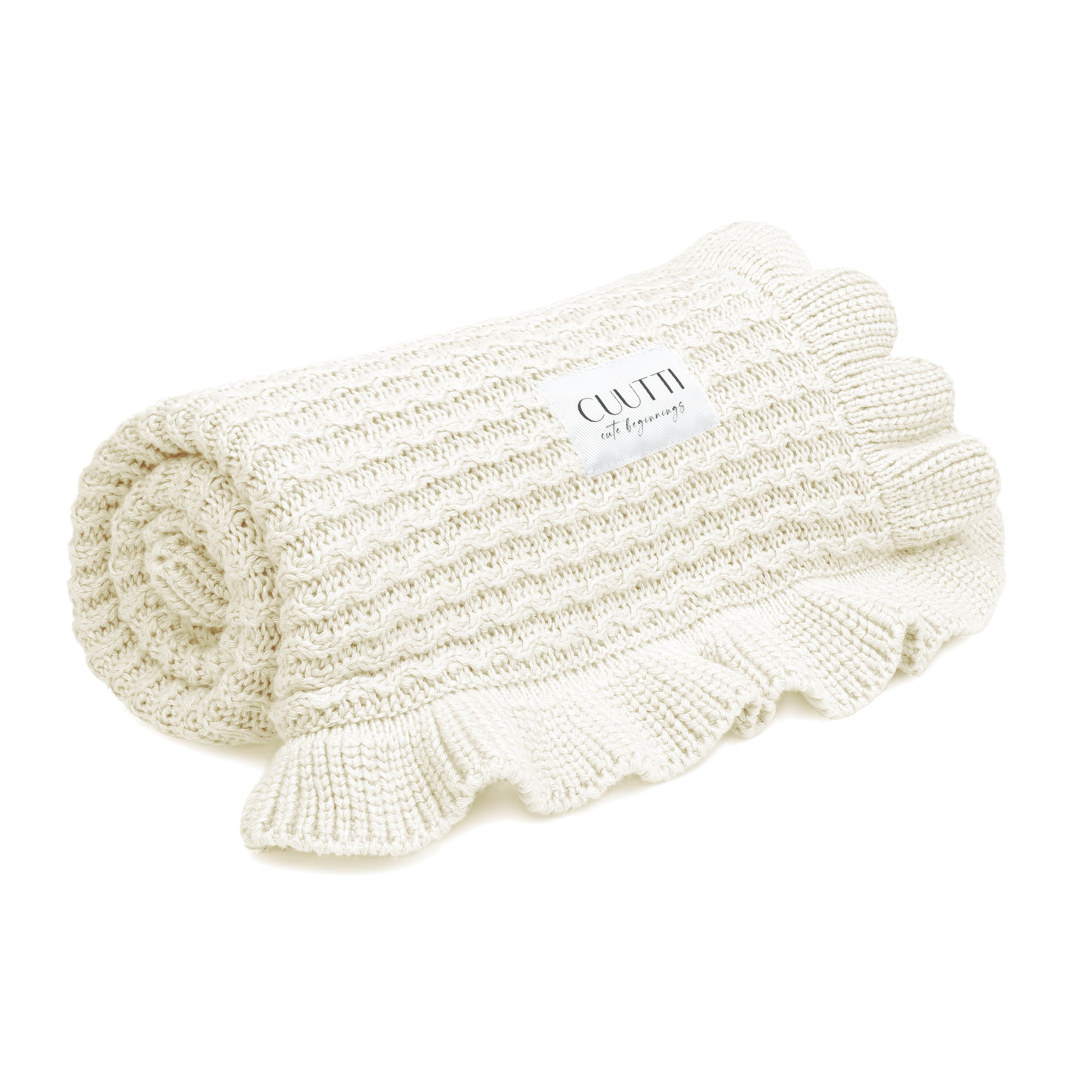 #color_ivory CUUTTI bamboo blanket Ballerina in ivory color, neatly rolled against a white background.